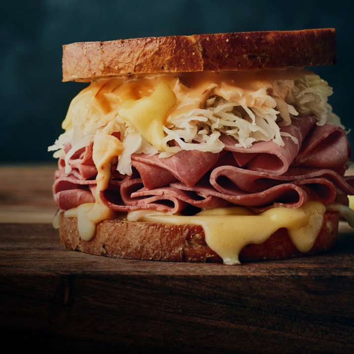 Close up view of classic corned beef reuben sandwich.